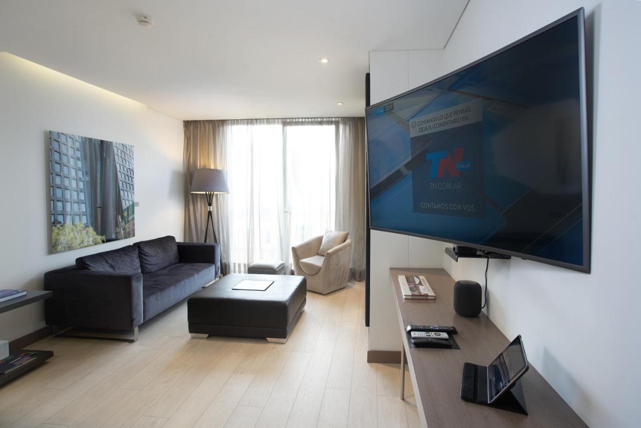 Hotel 100 Luxury Suites By Preferred Bogota Bagian luar foto A television set in a hotel room